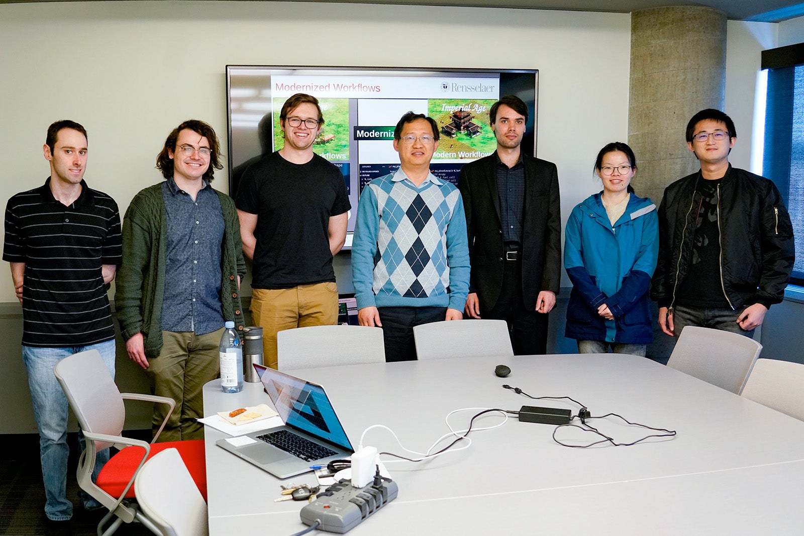 Professor Ji poses with memebers of his research group